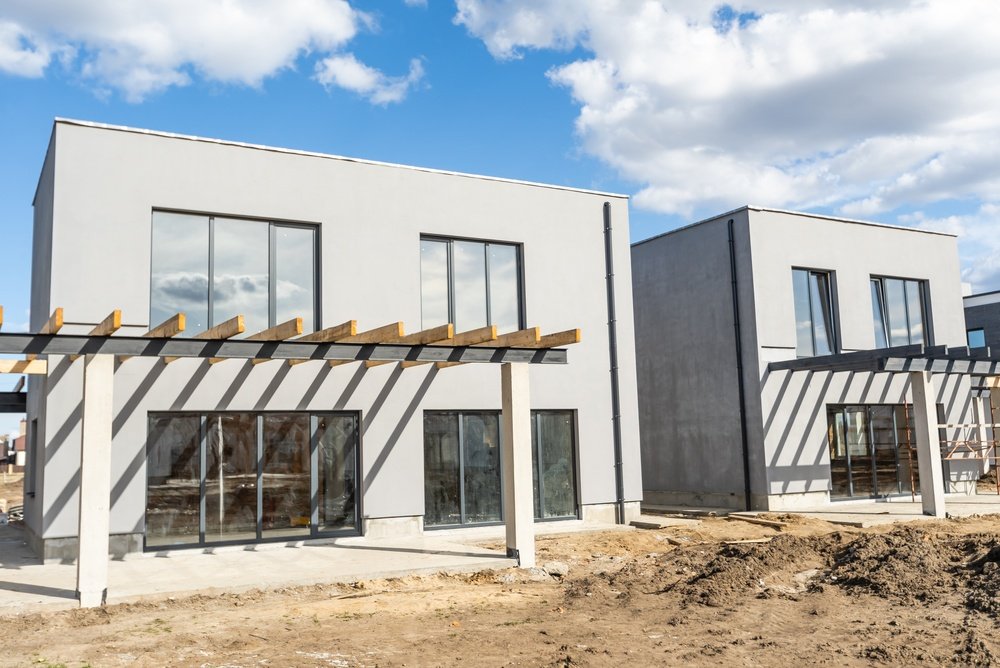 construction,residential,new,house,in,progress,at,building,site.